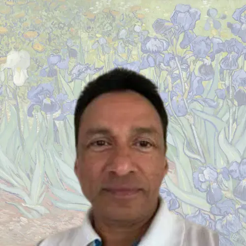 A man in a white shirt stands in front of a background featuring light purple irises, reminiscent of a Vincent van Gogh painting. STG-Health